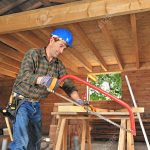 11730656-a-carpenter-working-in-his-house