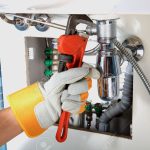 43563699-plumbing-work-and-sanitary-engineering-repairing-a-pipe-under-a-sink-sanitary-works-plumber